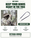 Jeff uses binoculars in the Idaho woods beside a black and purple JAKT GEAR binocular sling. Graphic highlights minimalist design, always at the ready, cross-body carry, and veteran-owned USA craftsmanship.